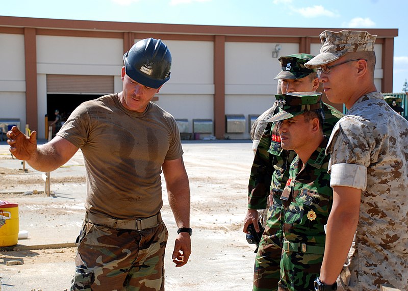 File:US Navy 071023-N-1120L-016 Steelworker 2nd Class John Palmer explains an ongoing project at Camp Shields to South Korean Colonel Son Yun Ki.jpg