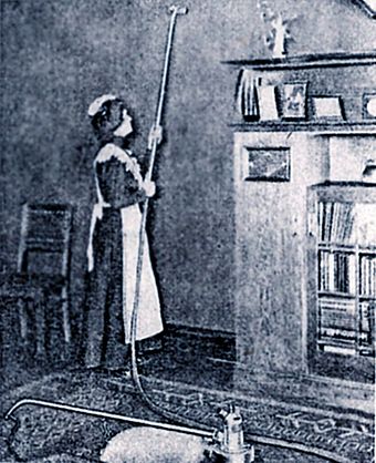 Housemaid using "dedusting pump", circa 1906.