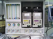 Anesthetic machine, showing sevoflurane (yellow) and isoflurane (purple) vaporizers on the right Vaporizer.jpg