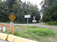 Boundary post in Point Roberts, Washington at the boundary between U.S. and Canada; photo taken at English Bluff Road, Delta facing Marine Drive, Point Roberts