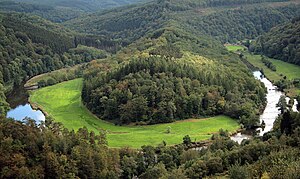 The "Tombeau du Géant" and the Semois river in Botassart, Belgium.