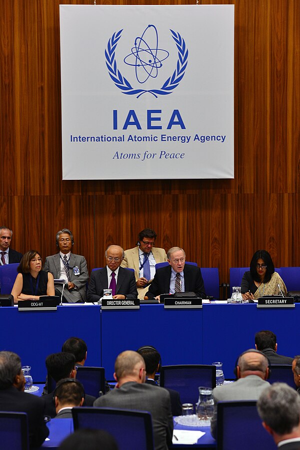 The "Atoms for Peace" slogan still in use above the panel at a 2013 IAEA meeting