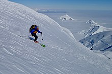 A mountaineer skis down Mt Francais during the first traverse of the mountain.