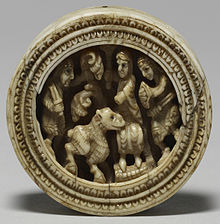 Anglo-Norman twelfth-century gaming piece, illustrating soldiers presenting a sheep to a figure seated on a throne Anglo-Norman - Game Piece with Enthroned Figure - Walters 71141.jpg