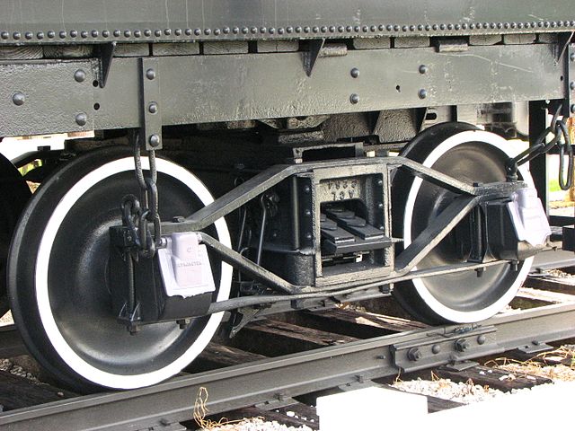 Archbar bogie with journal bearings in American style journal boxes, as used on some steam locomotive tenders. Archbar bogies (trucks) were also used on freight cars.