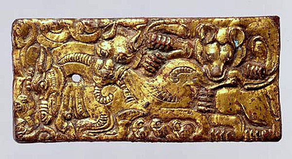 Belt buckle with animal combat scene, 2nd-1st century BCE, made in North China for the Xiongnu. These plates were inspired by the art of the steppes, but the design was flattened and compressed within the frame.[237][167]