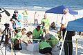 Biologists work with volunteers to excavate a sea turtle nest.jpg