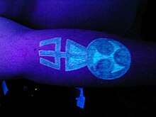 UV tattoo as shown under blacklight Black-light tattoo.jpg