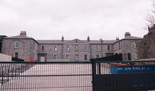 Gallery building seen through gates