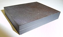 A small sample of aerospace grade carbon-fibre/epoxy laminate Composite laminate specimen.JPG