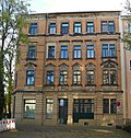 Apartment house in a corner and closed development