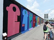 Thierry Noir mural painted on remnants of the Berlin Wall at the East Side Gallery in Berlin, 2011. East Side Gallery - Thierry Noir - 2010-07-28.jpg