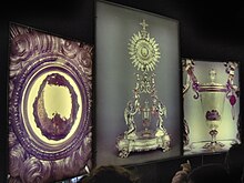 Close-ups of portions (left and right) of the reliquary (center) exhibited on rear-lighted panels Eucharistic Miracle of Lanciano - rear-lighted panel - side.JPG