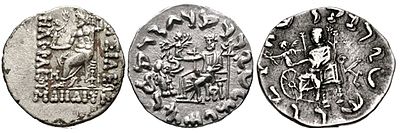 Evolution of Zeus Nikephoros ("Zeus holding Nike") on Indo-Greek coinage: from the Classical motif of Nike handing the wreath of victory to Zeus himself (left, coin of Heliocles I 145-130 BC), then to a baby elephant (middle, coin of Antialcidas 115-95 BC), and then to the Wheel of the Law, symbol of Buddhism (right, coin of Menander II 90-85 BC). Evolution of Zeus Nikephoros on Indo-Greek coinage.jpg