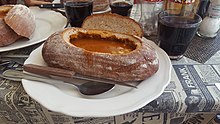 Goulash served in bread in a restaurant in Prague
