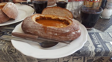 Goulash served in bread in a restaurant in Prague