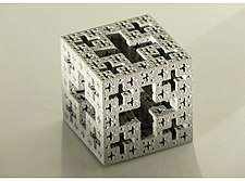 a cube formed of repeating plus-sign shaped holes