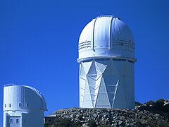Two of Kitt Peak's telescopes (right: Mayall 4-m telescope; left: Bok 2.3-m telescope)