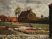 Het huis van Benedictus de Spinoza te Rijnsburg te midden van bloeiende tulpenvelden