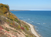 The clay bluffs on Lake Michigan and the Port Washington Breakwater Light seen from Lion's Den Gorge park in the Town of Grafton. LionsDen Oz-Co-WI.png