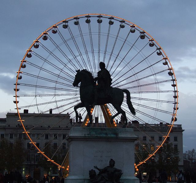Equestrian statue of Louis XIV, by François-Frédéric Lemot, with the Ferris wheel in the background