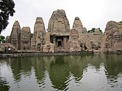 Masroor rock-cut temple and adjoining water tank.JPG
