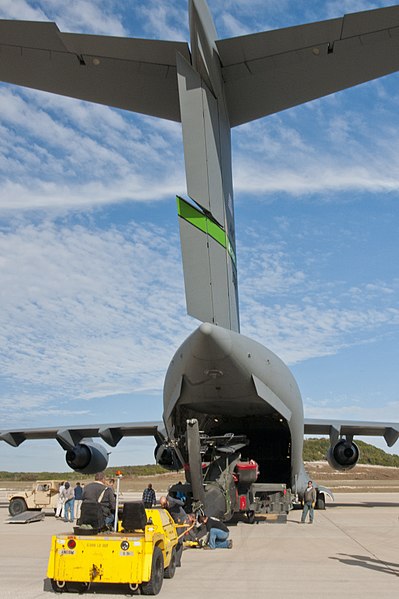 File:Members of the Fort Hood Arrival-Departure Airfield Control Group (A-DACG) and civilian contractors unload an AH-64D Apache Longbow helicopter out of a C-17 Globemaster III cargo plane at Robert Gray Army 131114-A-ZU930-053.jpg