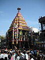 Huge throngs of devotees line the streets where the temple car passes on its route around the temple