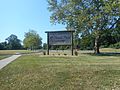 A sign in the median of the entrance.