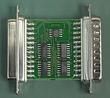 A Rainbow Tech parallel port dongle PCB, front side. Note the numbers rubbed off the chips to make reverse engineering harder Parallel-Port-Dongle-Front.jpg