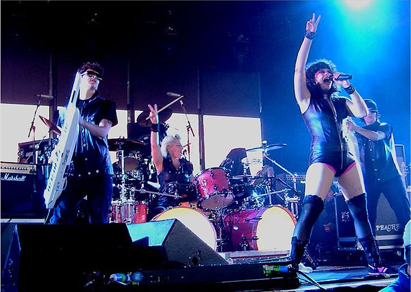 Maloney (second from left) performing with Peaches and the Herms in 2006.