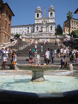 The Spanish Steps, seen from Piazza di Spagna. In foreground, the Fontana della Barcaccia