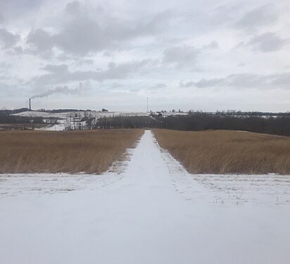 A road with snow on the ground