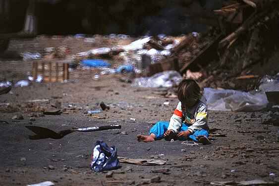 Child playing on a garbage dump at Sao Miguel, Azores