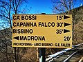 Guidepost at the crossing of the trail with the road to Bisbino, at Alpe Piella