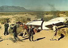 NRL scientists J. D. Purcell, C. Y. Johnson, and Dr. F. S. Johnson are among those recovering instruments from a V-2 used for upper atmospheric research above the New Mexico desert. This is V-2 number 54, launched January 18, 1951, (photo by Dr. Richard Tousey, NRL). Sl2lab06.jpg