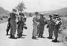The link-up at Milestone 109 between the two arms of the 14th Army which relieved the Japanese siege of Imphal. Soldiers of the two wings of the 14th Army link-up at Milestone 109 during the Battle of Imphal-Kohima.jpg