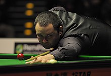 Stephen Maguire playing a shot