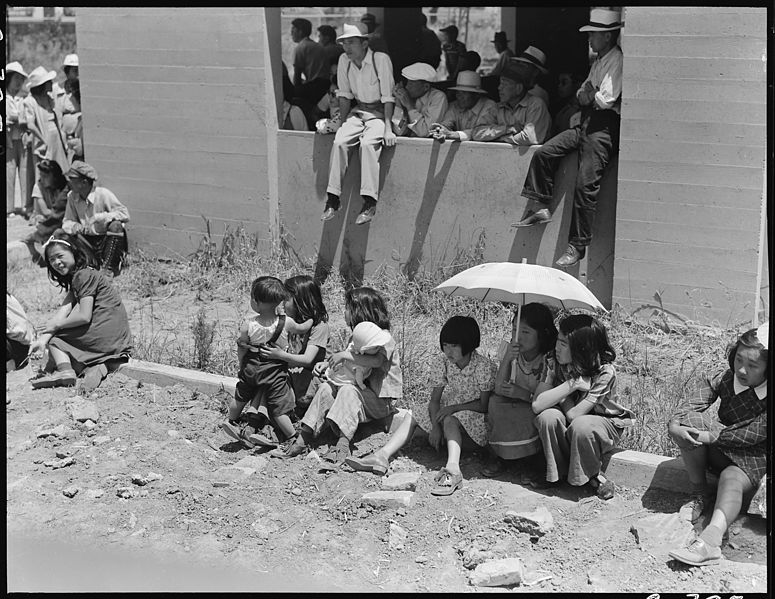 File:Stockton, California. These evacuees of Japanese ancestry are watching the arrival of buses bringin . . . - NARA - 537727.jpg