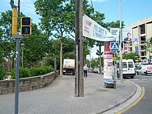 Street cleaning truck on sidewalk across from stadium (18612307191).jpg