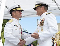 Rear Adm. Perry (left) receives the Legion of Merit from Rear Adm. Jeffrey Jablon (right) during the Commander, Submarine Group 9 change of command ceremony held at Deterrent Park, Naval Base Kitsap-Bangor on June 8, 2021. Submarine Group Nine Holds Change of Command 210608-N-AI605-0040.jpg