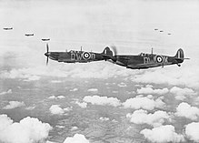 Supermarine Spitfire Mark Is, 24 July 1940. CH740 Supermarine Spitfire Mark Is of No. 610 Squadron based at Biggin Hill, flying in 'vic' formation, 24 July 1940. CH740.jpg
