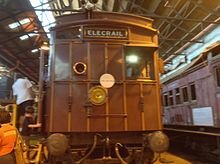 A restored swing-door driving car at the Steamrail open day, March 2014. It was destroyed by fire less than a year later. SwingDoor Newport Workshop.jpg