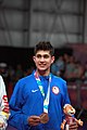 Deutsch: Tischtennis bei den Olympischen Jugend-Sommerspielen 2018: Tag 4, 10. Oktober 2018, Jungen-Einzel, Siegerehrung - Gold: Wang Chuqin (CHN), Silber: Tomokazu Harimoto (JPN), Bronze: Kanak Jha (USA); Medaillen überreicht durch IOC-Mitglied William Frederick Blick (UGA), Maskottchen überreicht durch ITTF-Präsident Thomas Weickert (GER) English: Fencing at the 2018 Summer Youth Olympics at 10 October 2018 –Boys' single medail ceremony – Gold: Wang Chuqin (CHN), Silber: Tomokazu Harimoto (JPN), Bronze: Kanak Jha (USA)); Medal presenter: IOC member William Frederick Blick (UGA), Mascot presenter: ITTF President Thomas Weickert (GER)