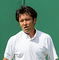 Tatsuma Ito competing in the first round of the 2015 Wimbledon Qualifying Tournament at the Bank of England Sports Grounds in Roehampton, England. The winners of three rounds of competition qualify for the main draw of Wimbledon the following week.