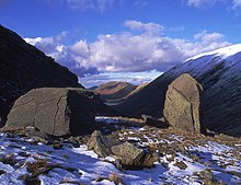 The church-like Kirk Stone at right, and nearby a nearly cuboid stone