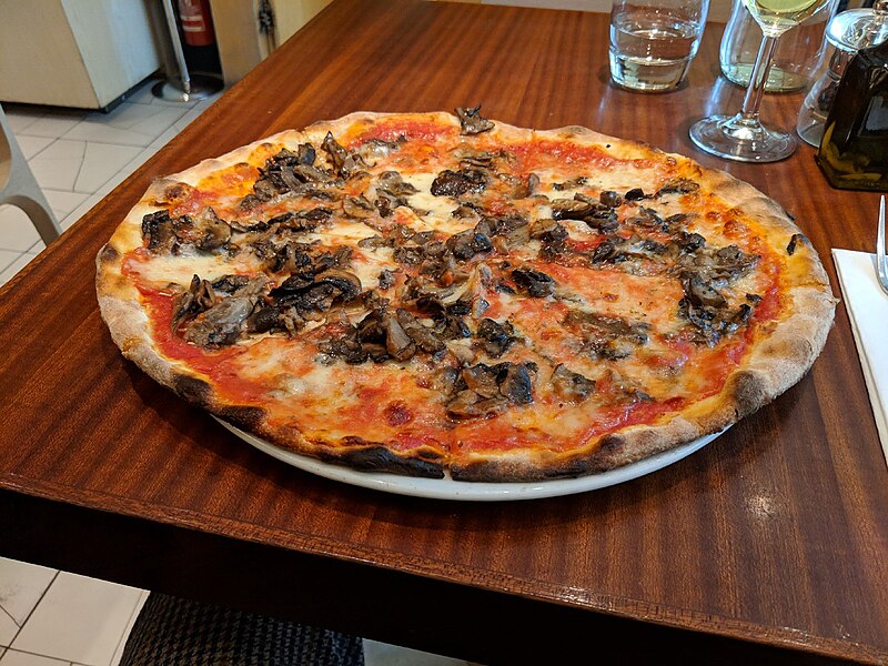File:Thin crust Roman style pizza on table.jpg