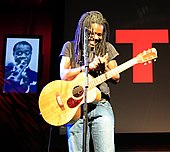 Tracy Chapman began singing about social issues in American society in the 1980s. Tracy Chapman at TED conference 2007 by jurvetson.jpg