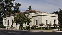 The Merced Post Office was built in 1933 in a Spanish Colonial Revival style by architects Allison & Allison.