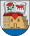 A coat of arms depicting an open book with a red rose on one page and a red bull on the other all hovering over a red heart with a building in the background